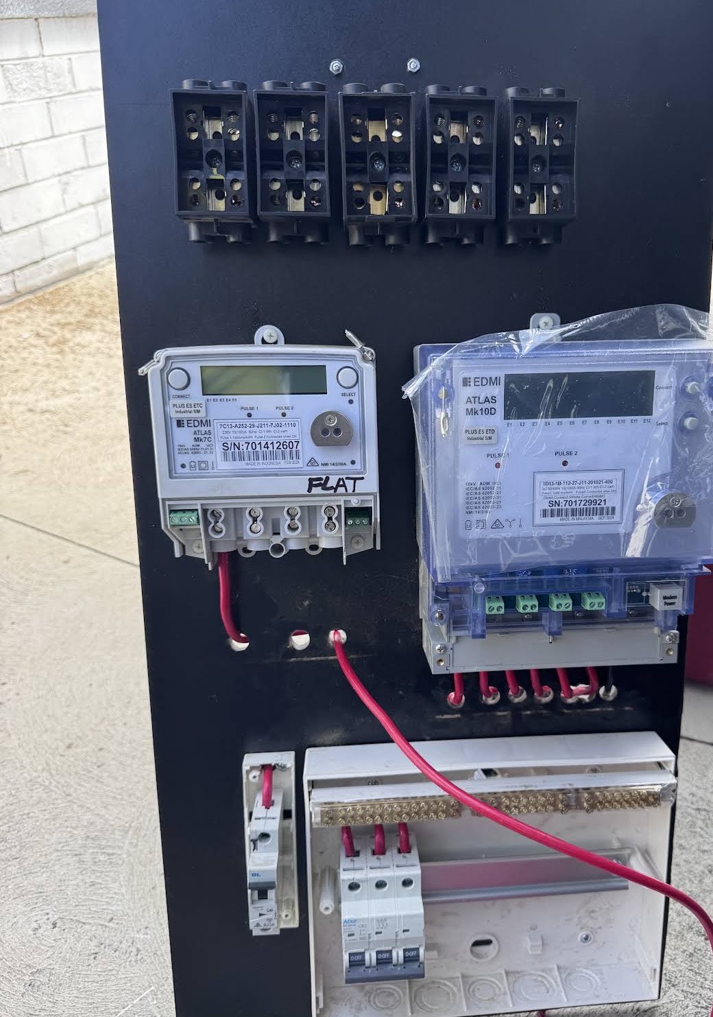Meter panel with two electricity meters, service fuses and circuit breakers